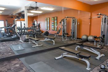 Clubhouse at Flats at 84 fitness center machines and free weights